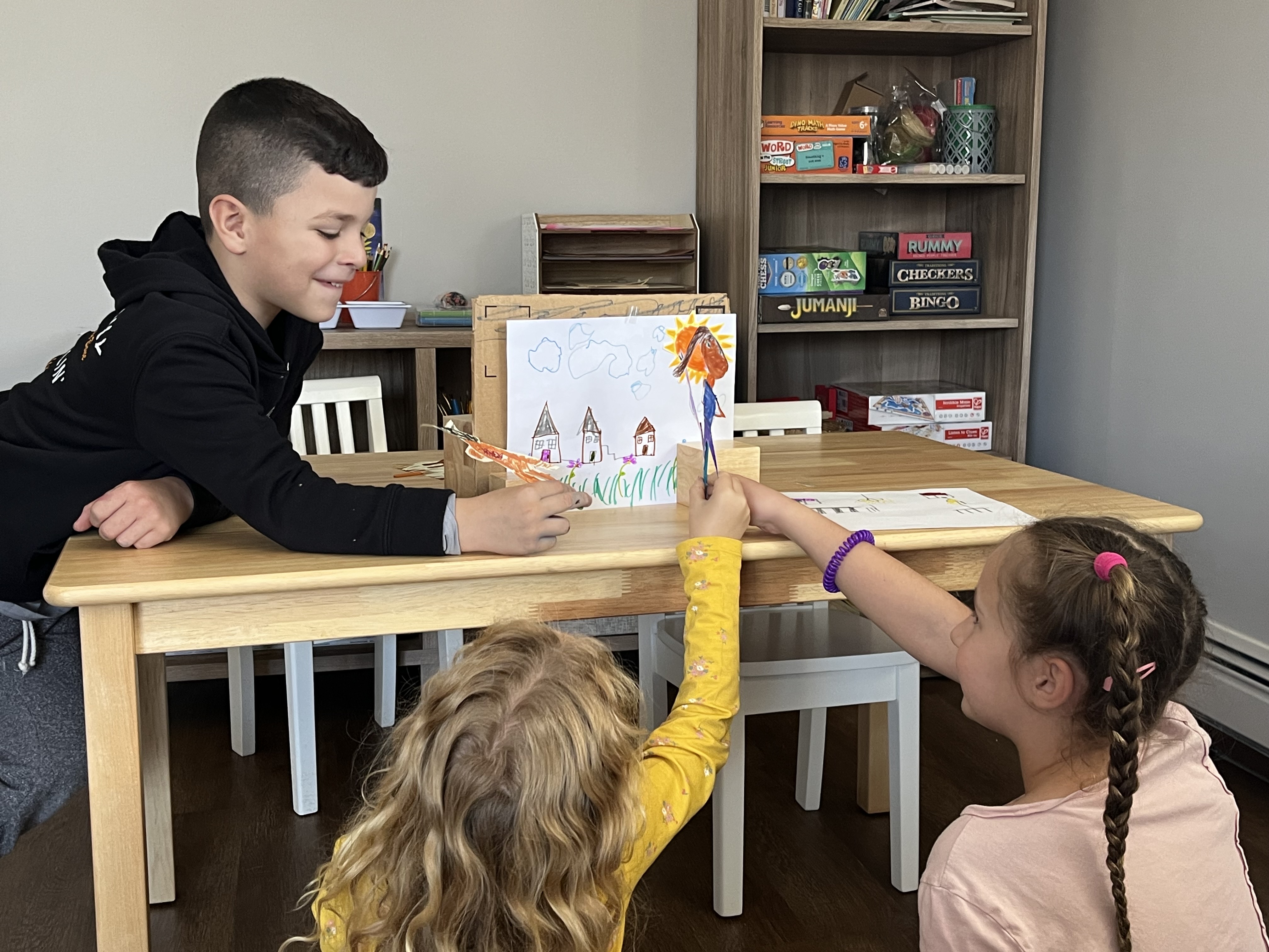 Moonstones-age children presenting work together at Elements Workspace.